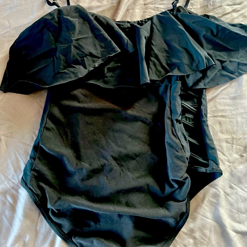One peice sexy bathing suit with cut out sides-